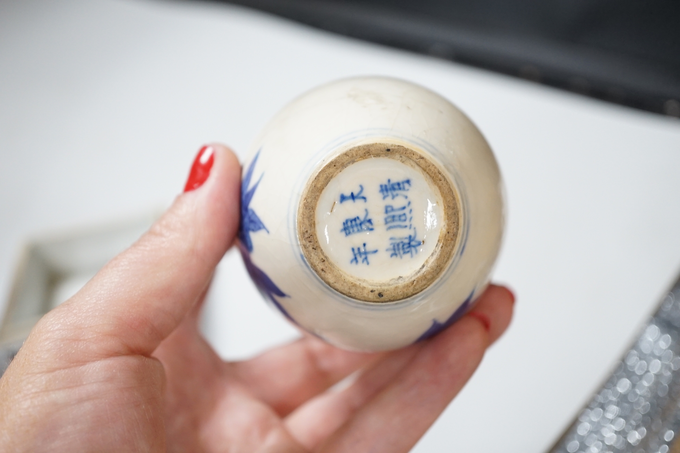 Three Chinese blue and white vases and a wucai square box, one with inscription, 18th century and later, tallest 14cm high